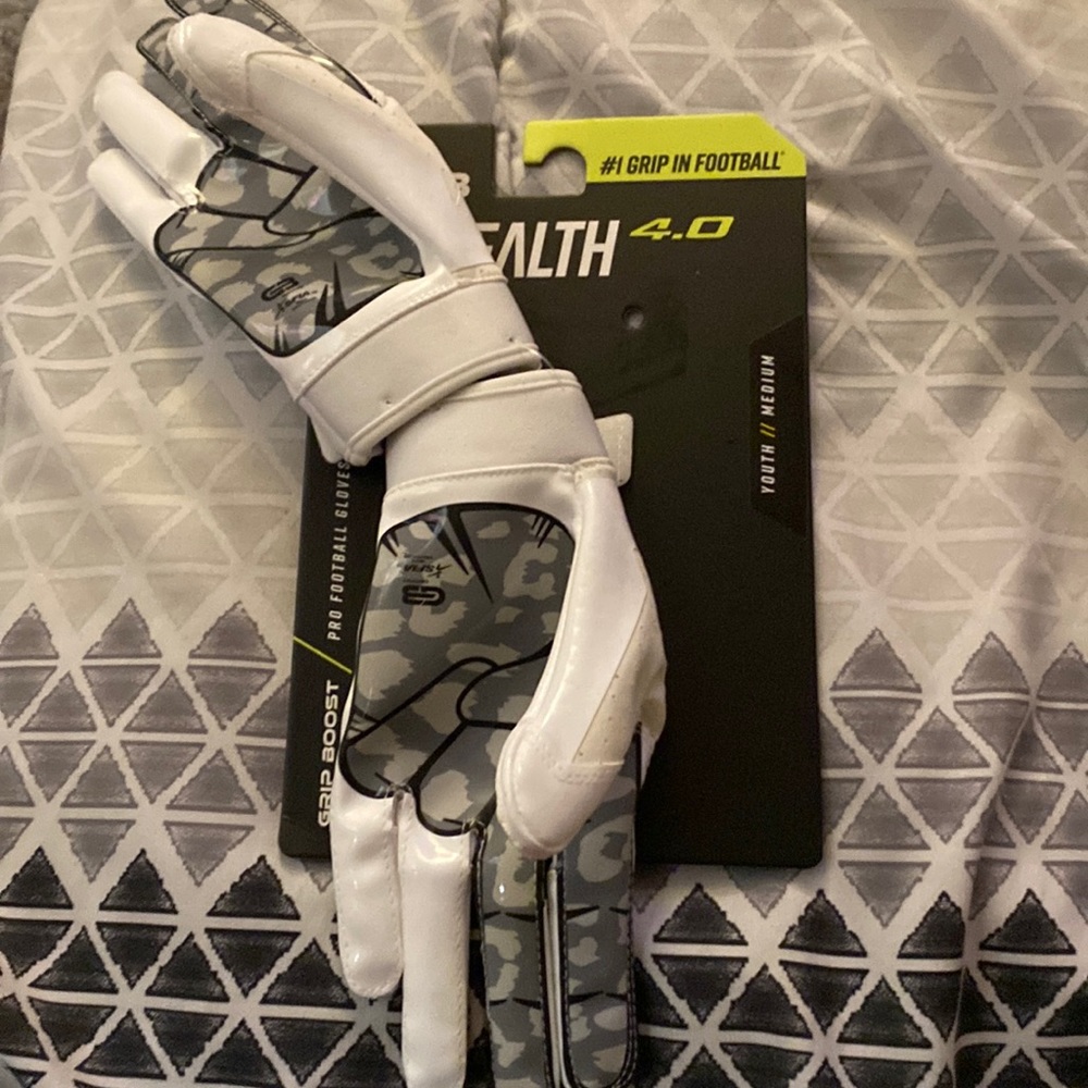 These are brand new and never worn football gloves made by the brand Grip Boost